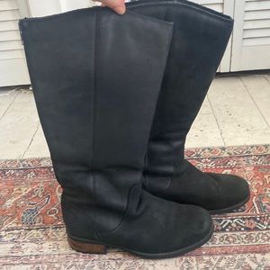 Tall black UGG leather boots